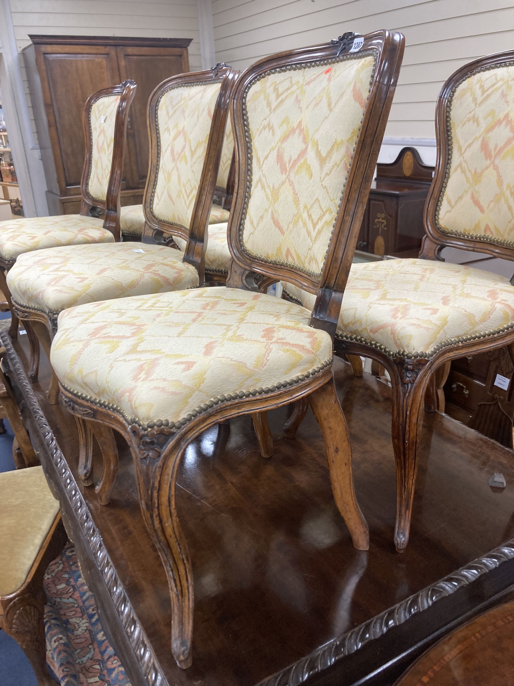 A set of six Louis XV style dining chairs, with cream and pink silk upholstery